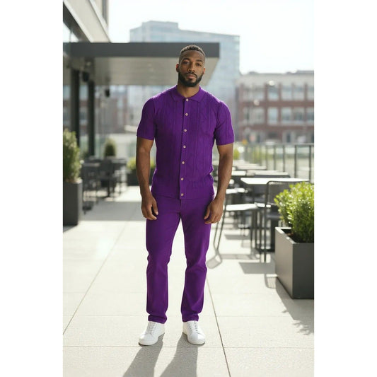 Man wearing a purple outfit standing outdoors on a sunny day.