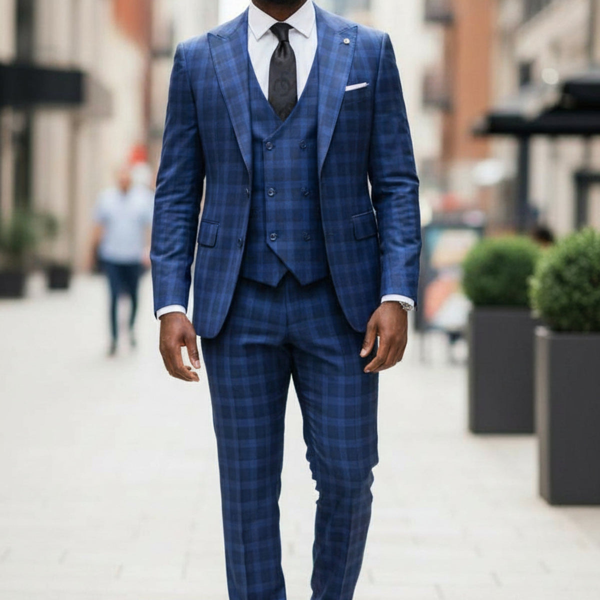 suit-yourself-menswear Tiglio Portofino blue and navy plaid 3-piece suit with a double-breasted vest on a man.