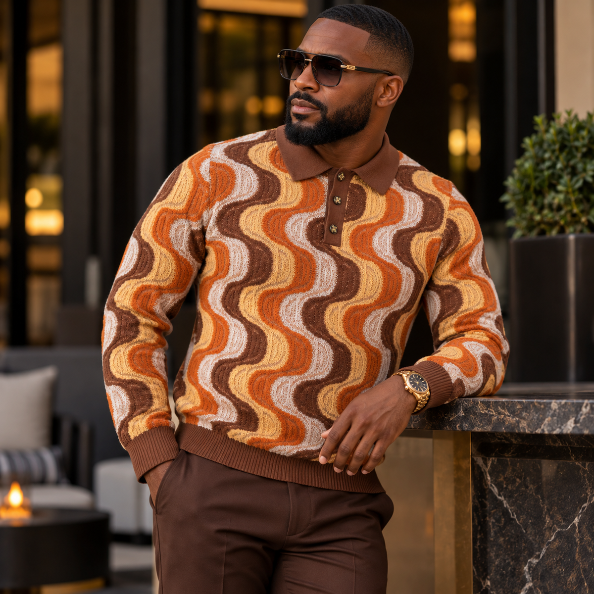 suit-yourself-menswear brown and orange wave pattern knit polo sweater with a three-button placket on a male model