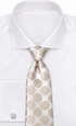 suit-yourself-menswear champagne gold polka dot necktie on a crisp white dress shirt with silver cufflinks