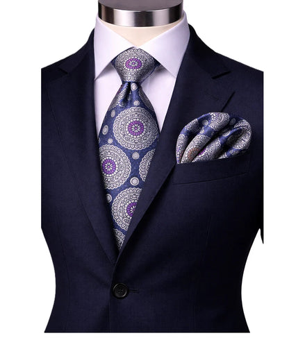 suit-yourself-menswear navy and purple medallion necktie with matching pocket square on a formal suit jacket