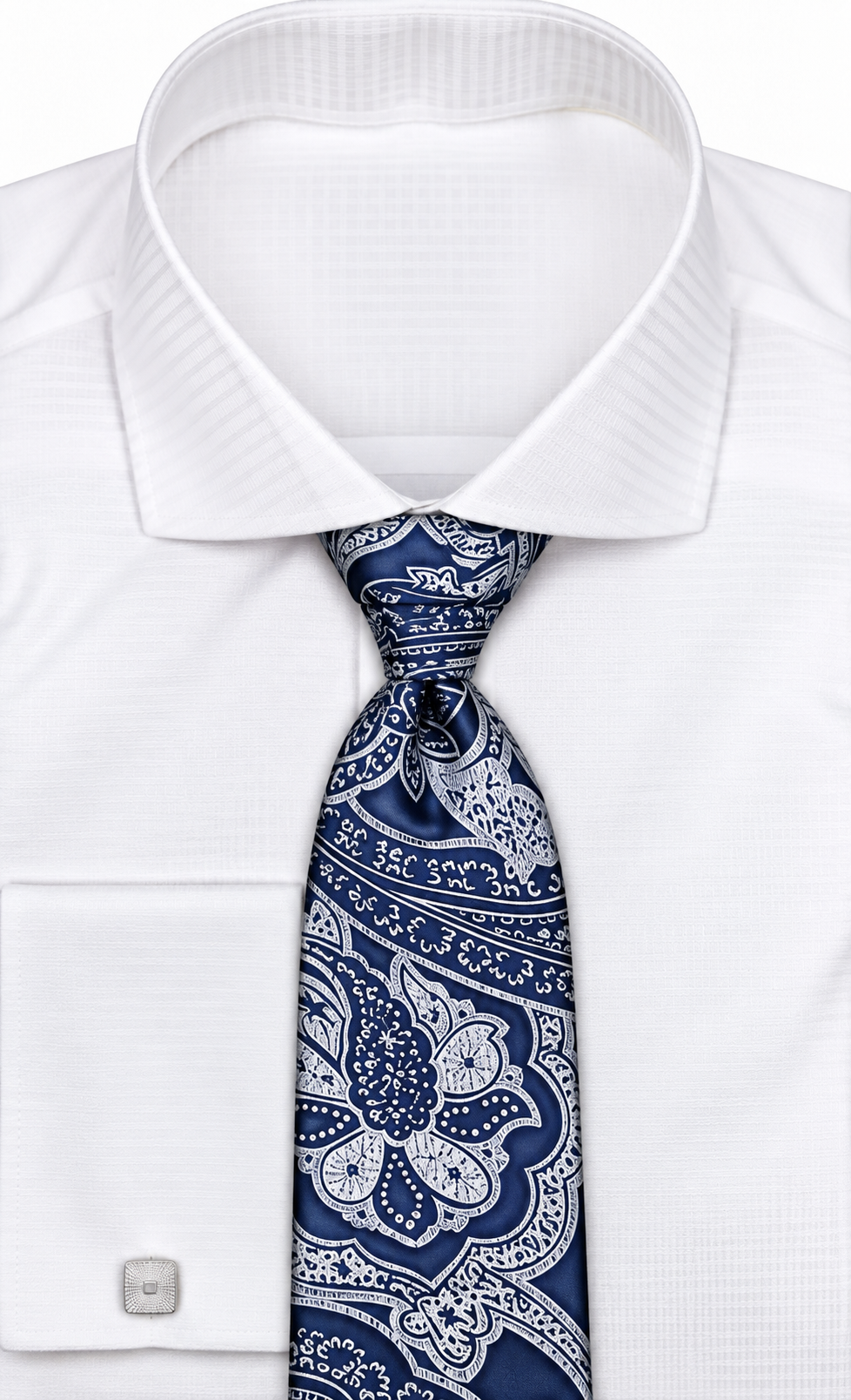 suit-yourself-menswear navy and white paisley necktie worn with a crisp white dress shirt and silver cufflinks