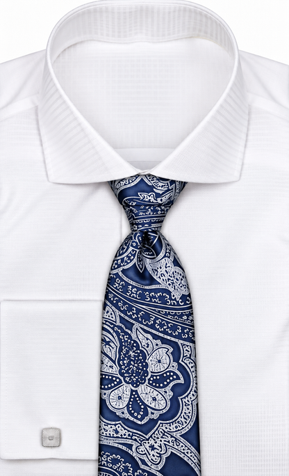 suit-yourself-menswear navy and white paisley necktie worn with a crisp white dress shirt and silver cufflinks