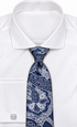 suit-yourself-menswear navy and white paisley necktie worn with a crisp white dress shirt and silver cufflinks