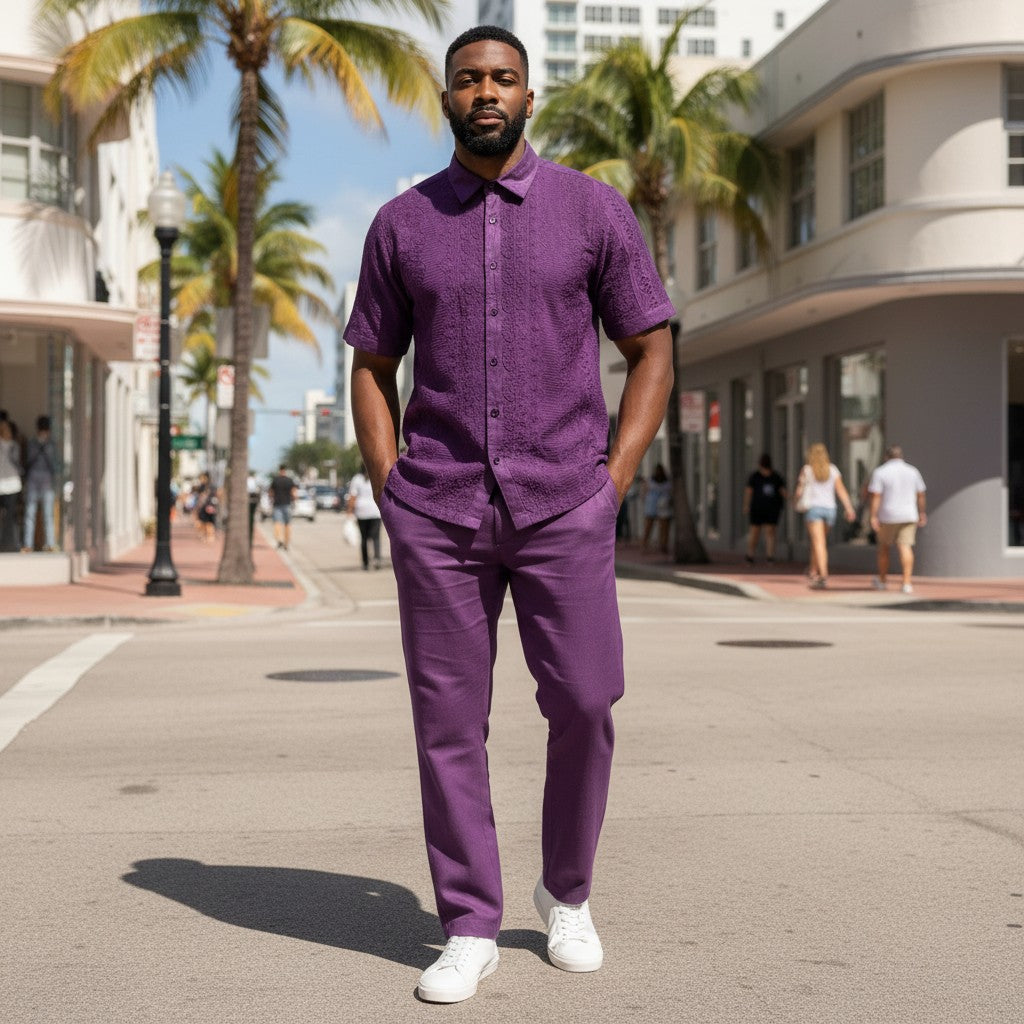 suit-yourself-menswear purple linen two-piece set with lace detailing worn by a man on a sunny city street