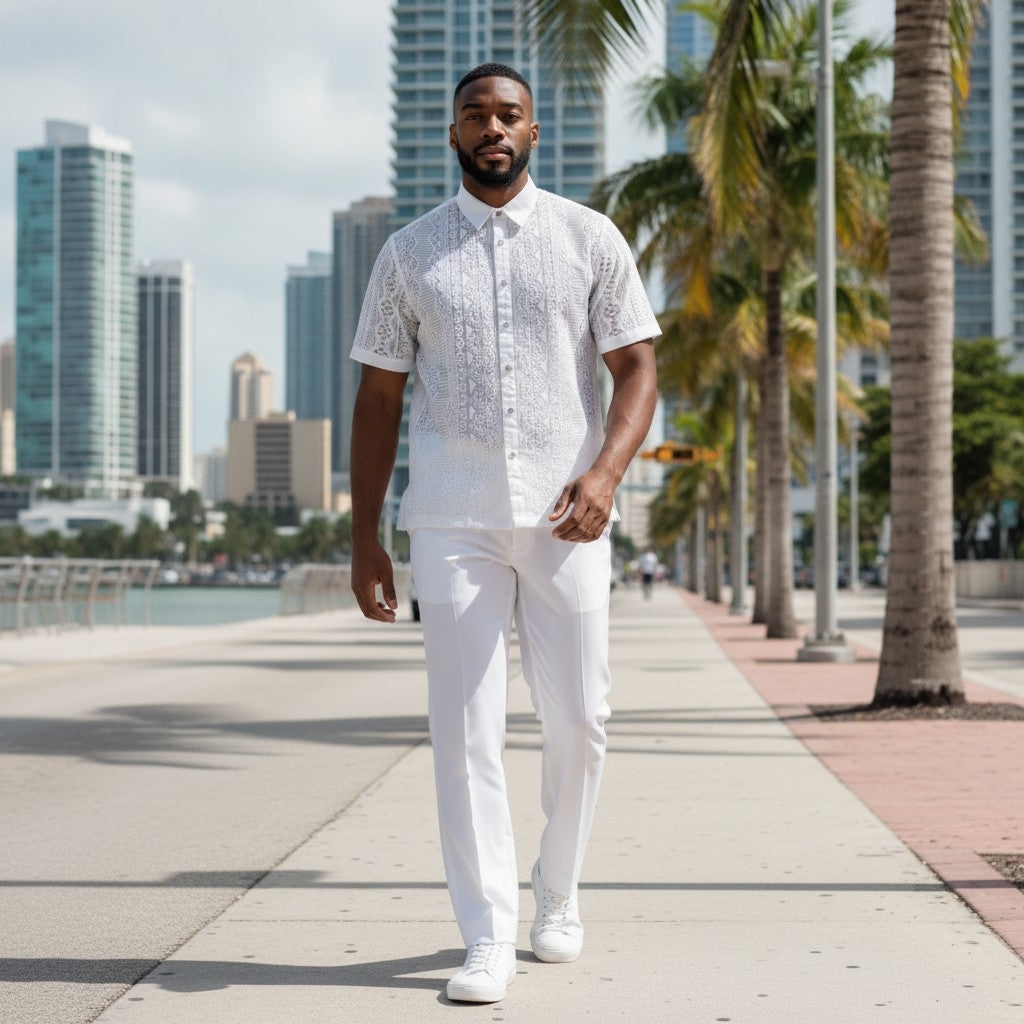 suit-yourself-menswear white lace linen two-piece casual set worn by a man walking on a sunny city waterfront promenade