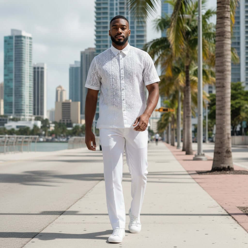 suit-yourself-menswear white lace linen two-piece casual set worn by a man walking on a sunny city waterfront promenade
